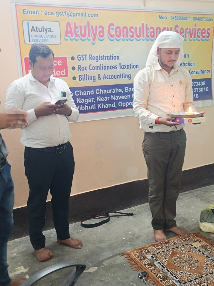Team members performing a puja at the Atulya office
